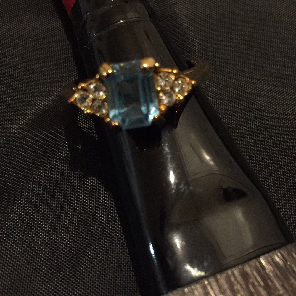 Gold tone ring with aqua stone